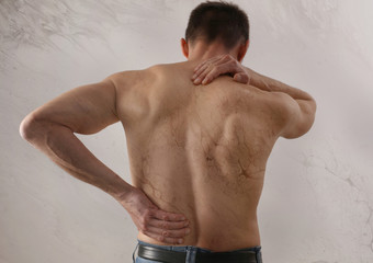 Back Pain Emotional causes. Male body anatomy aesthetic