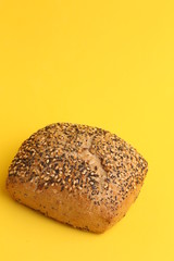 delicious bread rolls on colored background