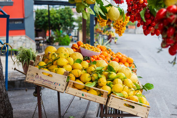 Huge lemons, tangerines and cherry tomatoes are sold on the Amalfi coast in Italy.