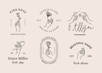A set of women's hand logos in a minimalistic linear style. Vector design of sign templates in various gestures.