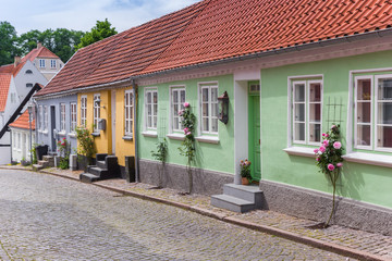 Colorful historic houses in a cobblestoned street of Haderslev, Denmark