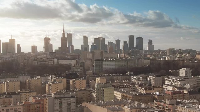 Aerial establishing shot of Warsaw on a partially cloudy day, Poland