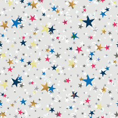 Seamless Gold , red, blue stars on a gray background.