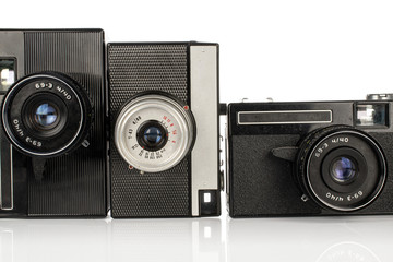 Group of three whole vintage camera isolated on white background
