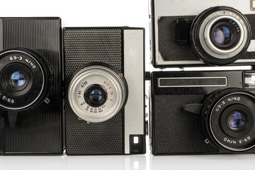 Group of four whole vintage camera isolated on white background