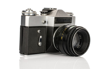 One whole old vintage camera isolated on white background