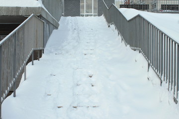 Stairs covered with snow, after a heavy snowfall in winter