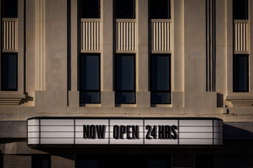 a building's open 24 hours sign