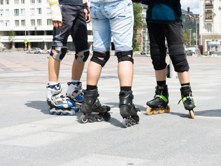 Fototapeta premium Close-up view of male legs in roller skates. Figure skating on roller skates.