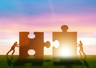 Business metaphor of teamwork with jigsaw puzzle