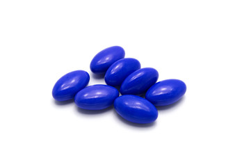 Obraz na płótnie Canvas Medical pills with blue color on white background.