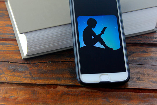 Rio de Janeiro, Brazil - November 25, 2019: Kindle logo on the mobile phone screen. is a digital book reader developed by Amazon