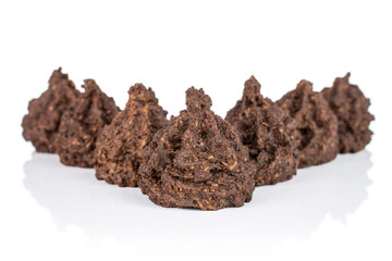 Group of seven whole homemade brown coconut cocoa biscuit isolated on white background