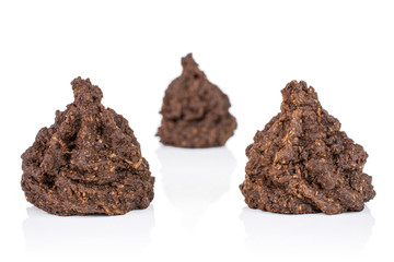 Group of three whole homemade brown coconut cocoa biscuit isolated on white background