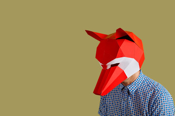 young man with a red fox mask