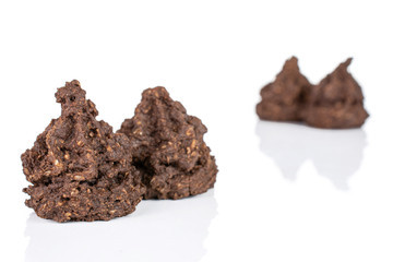 Group of four whole homemade brown coconut cocoa biscuit isolated on white background