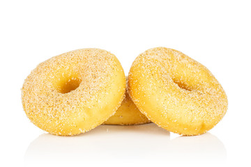 Group of three whole sweet golden mini cinnamon donut isolated on white background