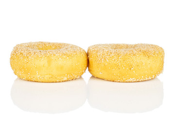 Group of two whole sweet golden mini cinnamon donut isolated on white background