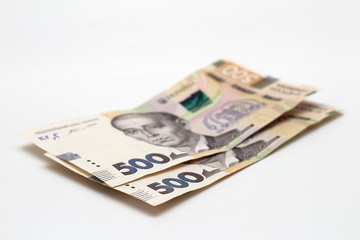 Two new banknotes in denominations of 500 Ukrainian hryvnias isolated on a white background with shadow. European money exchange. Ukraine currency