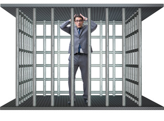 Businessman in the cage isolated on white