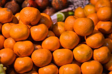 India - February 6, 2020: juice and fresh oranges, in Indian fruit market 