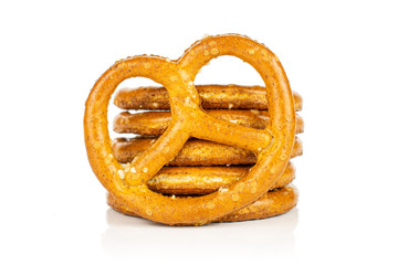Group of six whole salty brown pretzel isolated on white background