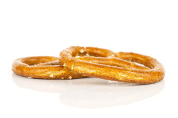 Group of two whole salty brown pretzel isolated on white background