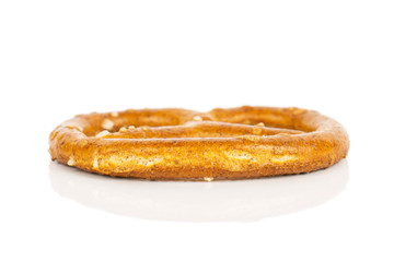 One whole salty brown pretzel isolated on white background