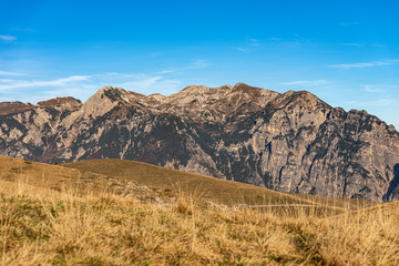 Fototapeta premium Lessinia Plateau and Italian Alps with the Mount Carega, called also the small Dolomites. Regional Natural Park, Verona province, Veneto, Italy, Europe