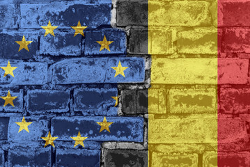The flag of the European Union and Belgium on a brick wall