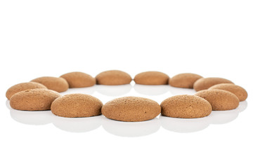 Lot of whole sweet brown chocolate sponge biscuit in circle isolated on white background