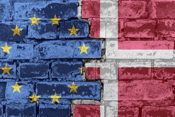 The flag of the European Union and Denmark on a brick wall