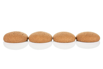 Group of four whole sweet brown chocolate sponge biscuit isolated on white background