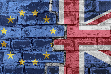 European Union and UK flag on brick wall