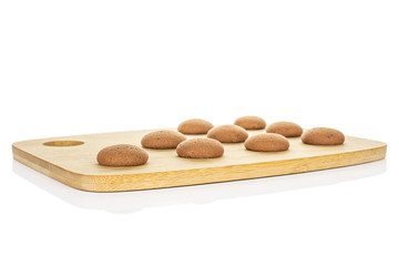 Group of nine whole sweet brown chocolate sponge biscuit on bamboo cutting board isolated on white background
