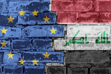 The flag of the European Union and Iraq on a brick wall