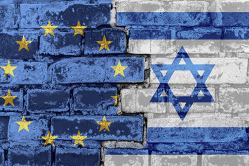 The flag of the European Union and Israel on a brick wall
