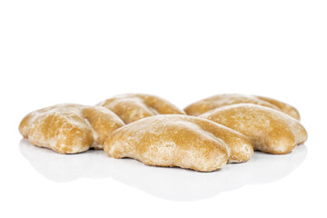 Group of five whole sweet brown gingerbread isolated on white background