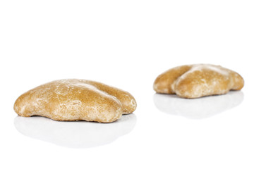 Group of two whole sweet brown gingerbread isolated on white background
