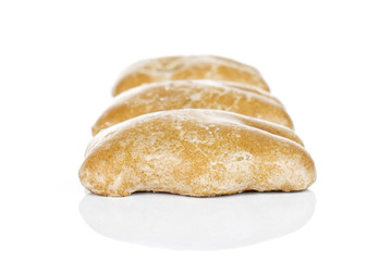 Group of three whole sweet brown gingerbread in row isolated on white background