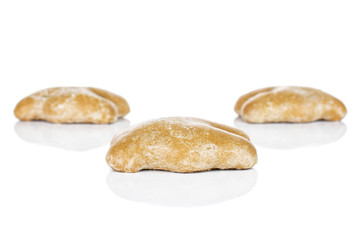 Group of three whole sweet brown gingerbread isolated on white background
