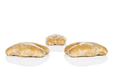 Group of three whole sweet brown gingerbread isolated on white background