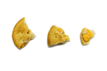 Fototapeta na wymiar Crumbs of sandwich cracker Cheese biscuits flavoured ,Cream and butter. Crunchy delicious sweet meal and useful cookies. Isolated on white background.