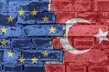 European Union and Turkey flag on a brick wall