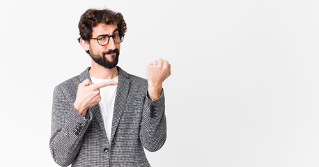 young crazy businessman looking impatient and angry, pointing at watch, asking for punctuality,...