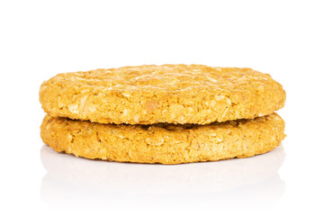 Group of two whole sweet golden oat cookie isolated on white background