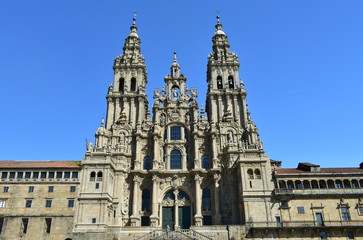 Fototapeta na wymiar Cathedral, facade view from Praza do Obradoiro with blue sky. Santiago de Compostela, Galicia, Spain.