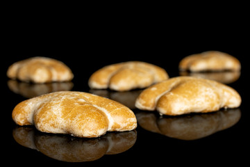 Group of five whole sweet brown gingerbread isolated on black glass