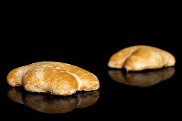Group of two whole sweet brown gingerbread isolated on black glass