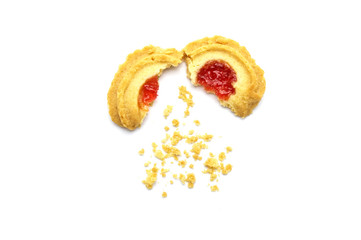 Butter cookies strawberry jam topping flavored. Some cracks and crumbs. Crunchy delicious sweet meal and useful biscuits on white background.
